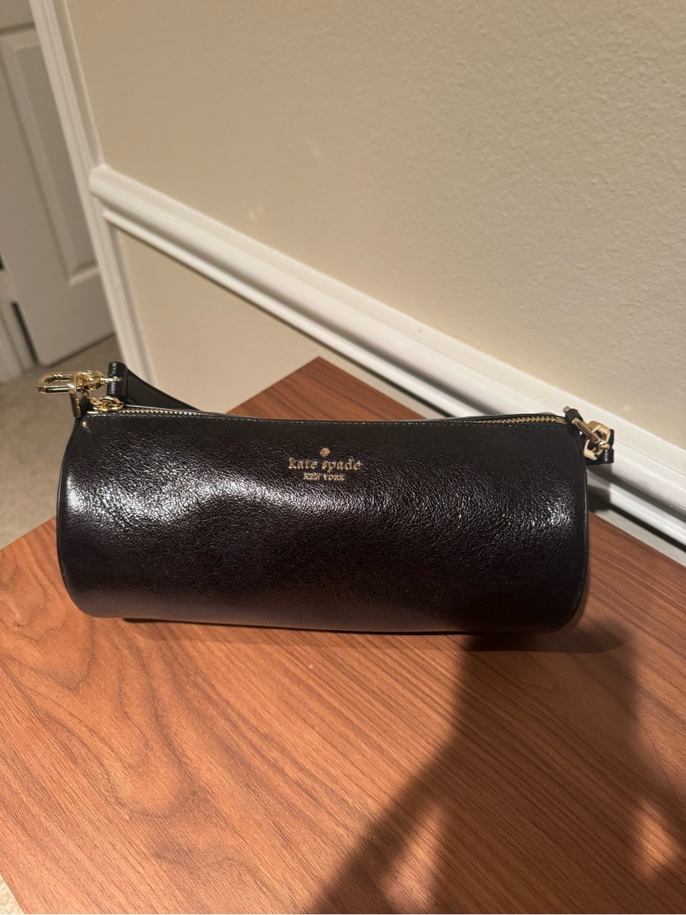 kate spade black leather barrel bag with gold hardware